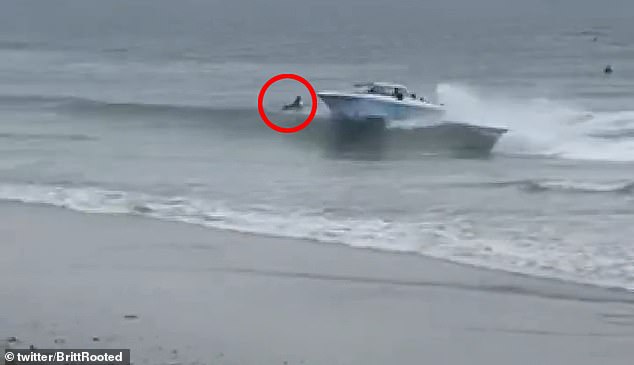 dramatic moment migrants in a speed boat nearly run over surfers in the water in california as they make a run towards land and avoid us border security