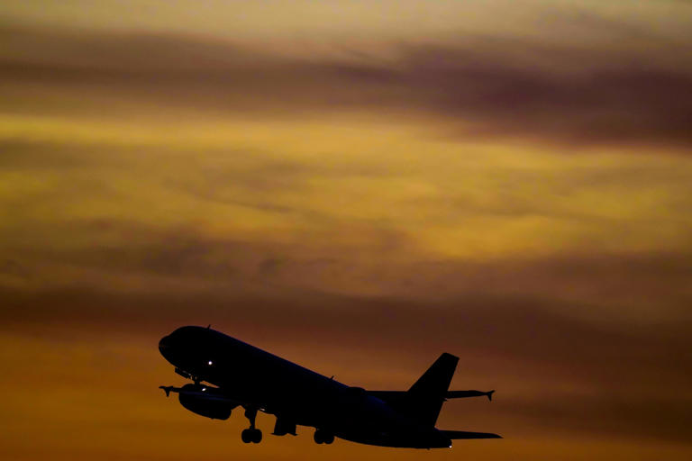 A commercial airplane takes off from Austin-Bergstrom International Airport. The U.S. Department of Transportation says it will look into flight cancellations by Southwest that have left travelers stranded at airports across the country amid an intense winter storm.