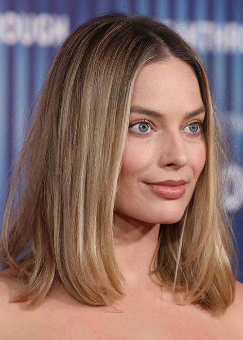 finally! margot robbie heads back to black and can ditch the barbie pink