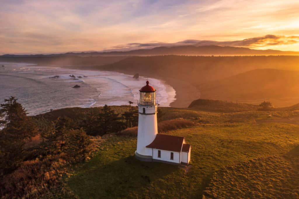 <p><strong>Year lit:</strong> 1870</p><p><strong>Height:</strong> 59 feet</p><p>MilePost 296.6, near Port Orford, houses the oldest standing lighthouse on the Oregon Coast. The tower is not open and requires repair. However, you can tour the signal workroom. A separate building, formerly a garage, now houses the ticket office and a gift shop.</p><p>Daily guided tours of the workroom are available from April through October from 10 am to 3:30 pm. Note that tours are not offered on Tuesdays.</p>