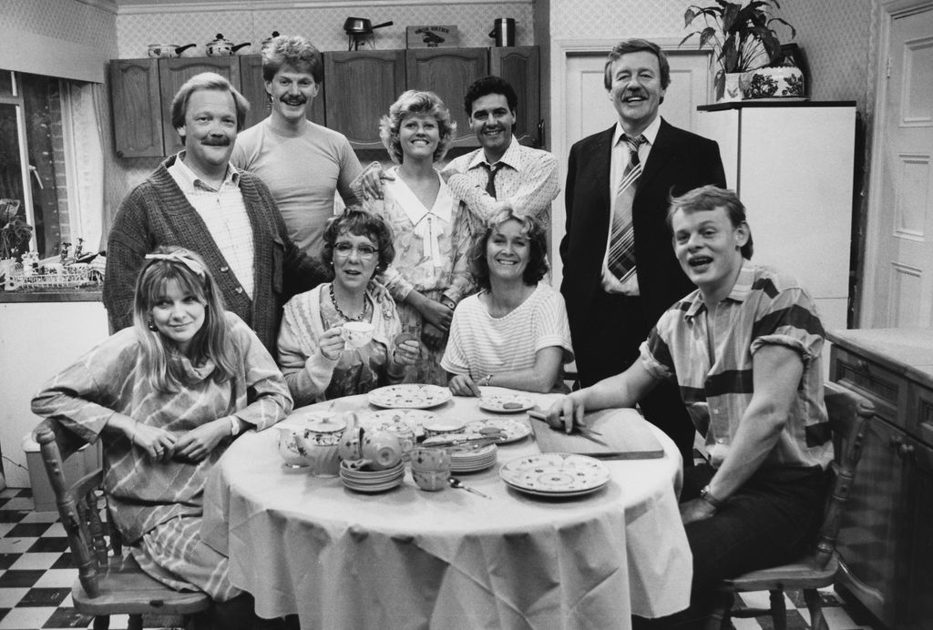 <p>After studying at the prestigious performing arts school, ArtsEd, in London, Martin bagged his first TV role at the age of 22 in the sitcom <em>No Place Like Home</em> in 1983. He portrayed Nigel Crabtree for three years, starring alongside Patricia Garwood and William Gaunt. </p><p>Here, Martin's pictured with his co-stars in 1985 looking particularly fresh-faced. After being spotted by fellow comedy actor Harry Enfield. Martin then began starring in his sketch shows, before the two went on to appear in <em>Men Behaving Badly.</em> </p>