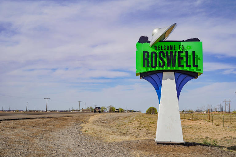 A spaceship on the Welcome to Roswell sign in New Mexico, USA.
