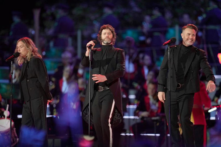 Mark Owen, Howard Donald, and Gary Barlow of Take That perform during the Coronation Concert last year