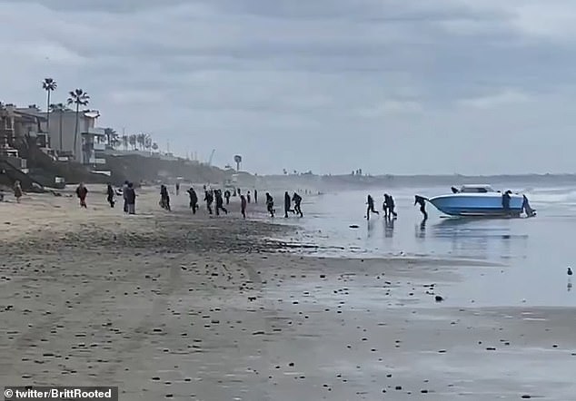dramatic moment migrants in a speed boat arrive on a california beach