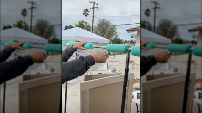 the pool noodle hack that makes spray painting cabinet doors a breeze