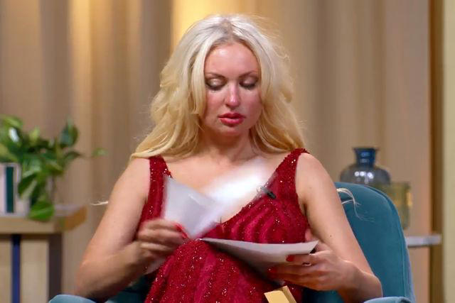 TLC Natalie examines the divorce papers presented to her on 90 Day: The Single Life.