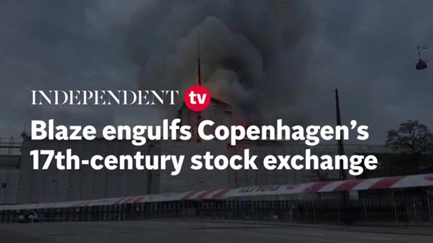 Moment 180ft spire collapses as blaze engulfs Copenhagen’s 400-year-old stock exchange