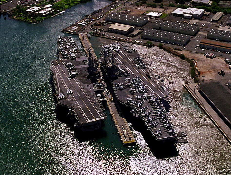 <p>Commissioned in 1961, the USS Kitty Hawk quickly distinguished itself as a formidable asset in the U.S. Navy's carrier fleet. It notably received the Presidential Unit Citation in January 1969 for the pivotal role its crew and Carrier Air Wing Eleven played during the intense combat of the Vietnam War. Even as the dawn of the new millennium brought advanced technology and new classes of carriers, the Kitty Hawk remained a crucial platform for military operations, notably during Operation Southern Watch in the early 2000s.</p>