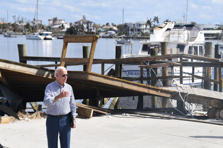 President Joe Biden speaks during a visit to Fort Myers, Florida, after 2022’s Hurricane Ian. The Biden administration is seeking to penalize Lee County and its cities for rebuilding in flood-prone areas after the storm. Olivier Douliery / AFP via Getty Images