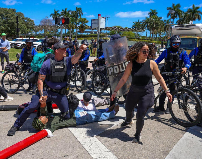 About seven protesters lay down in the intersection of NE 3rd Street and northbound Biscayne Blvd and were later arrested by Miami Police on Monday, April 15, 2024, in downtown Miami, Florida.