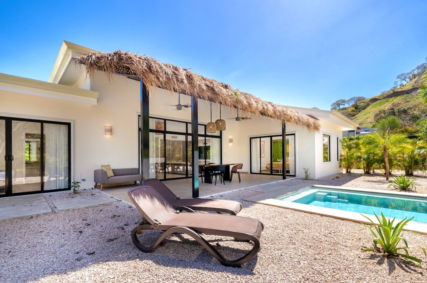 <a>This "tropical chic" villa is just a quick stroll from a fantastic surf beach.</a>