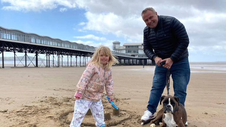 Rosie, her dog Rolo and her dad had the beach to themselves at Weston-super-Mare