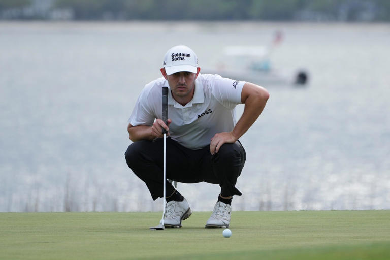Apr 17, 2022; Hilton Head, South Carolina, USA; Patrick Cantlay lines up a putt on the 18th green during the final round of the RBC Heritage golf tournament. Mandatory Credit: David Yeazell-USA TODAY Sports