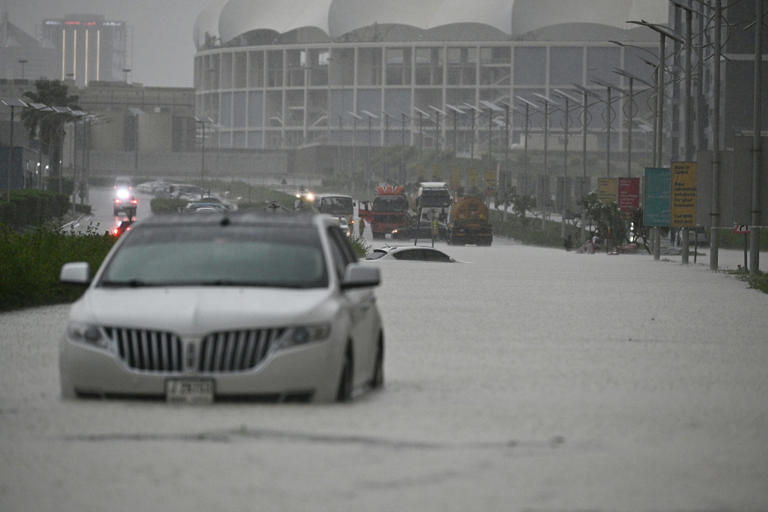 Vehicles hardly move on flooded streets due to heavy rain in Dubai on April 16, 2024. Stringer/Anadolu/Getty Images