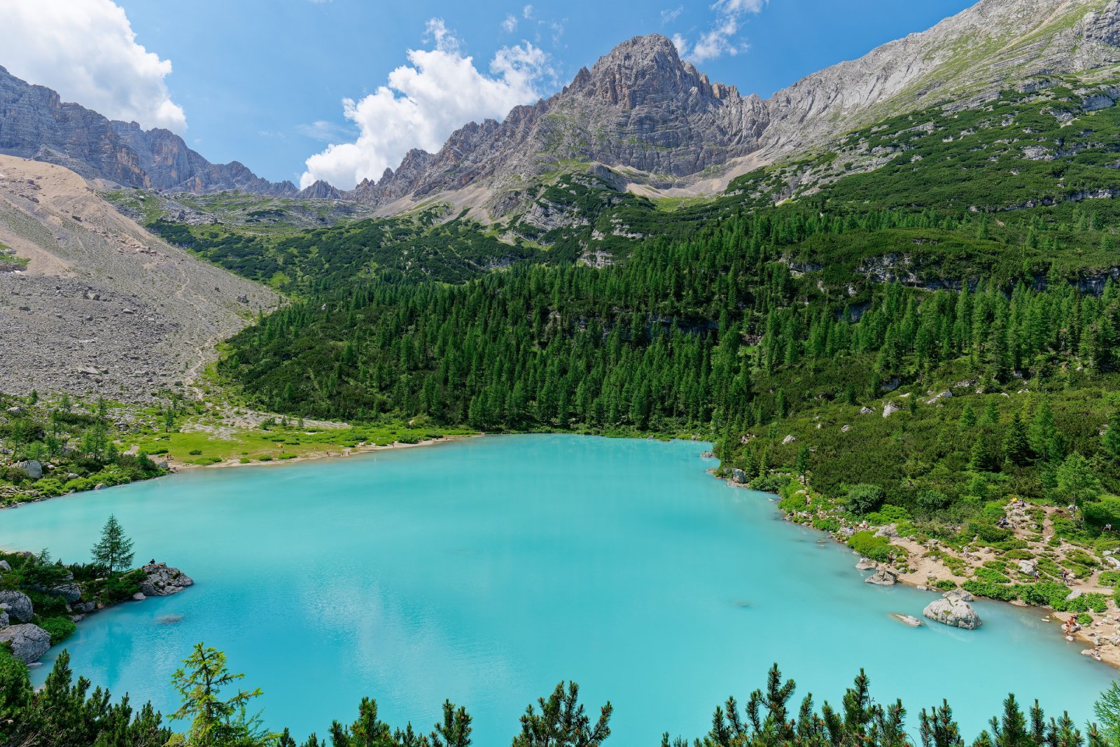 <p class="wp-caption-text">Image Credit: Shutterstock / stu.dio</p>  <p><span>Lago di Sorapiss, with its distinctive turquoise waters, is a hidden gem in the Dolomites. The lake is reached via a moderately challenging hike through the Sorapiss mountain range, offering stunning views and a tranquil setting. The journey to the lake is an adventure in itself, featuring narrow paths, wooden bridges, and dramatic cliffside views.</span></p>