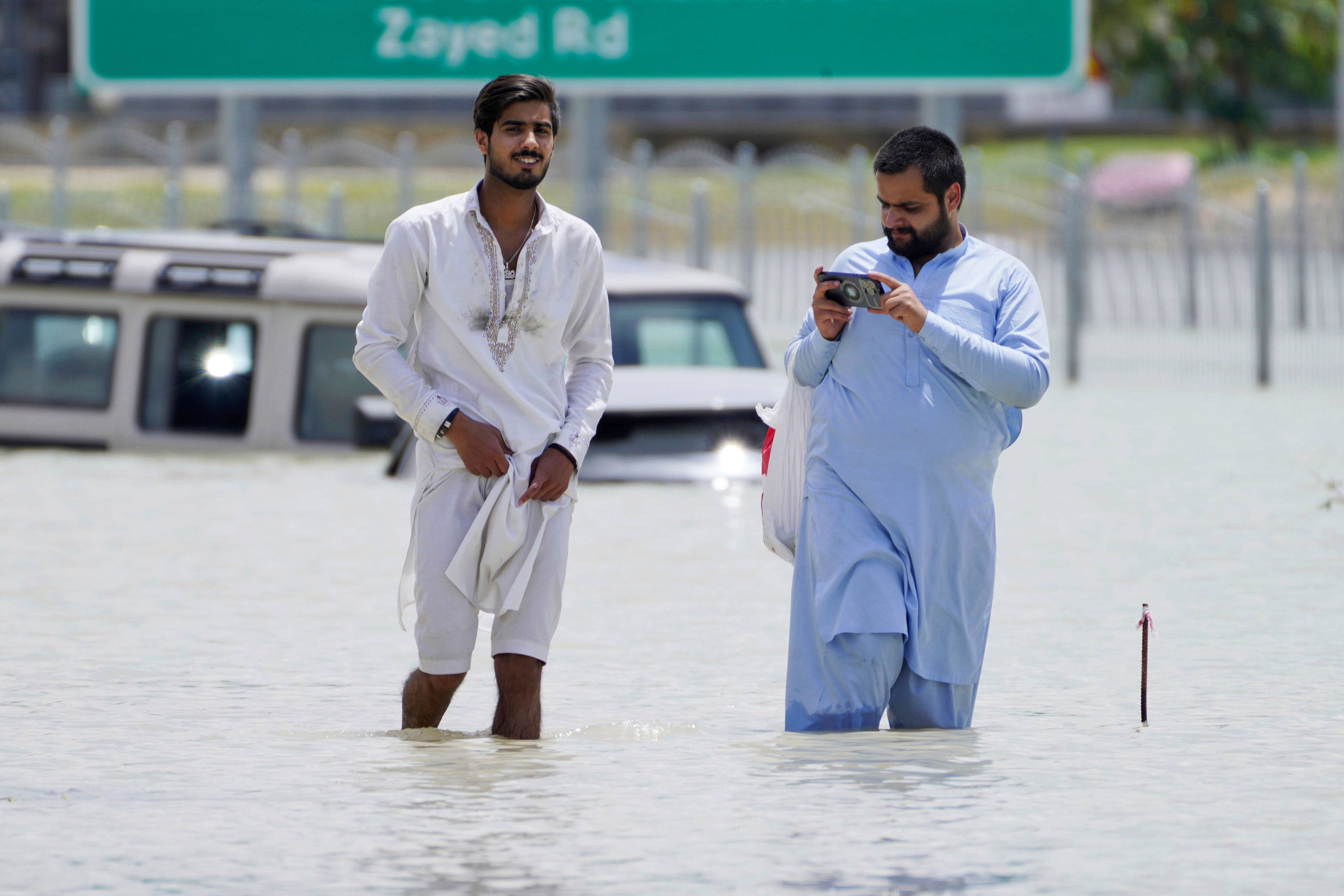 in pictures: dubai reels from floods after storm brings year and a half’s worth of rain in one day