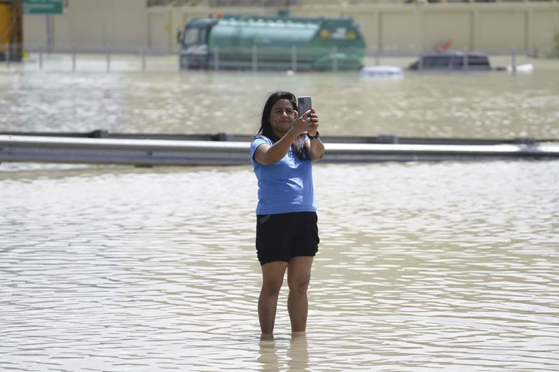 the desert nation of uae records its most rain ever, flooding highways and dubai's airport