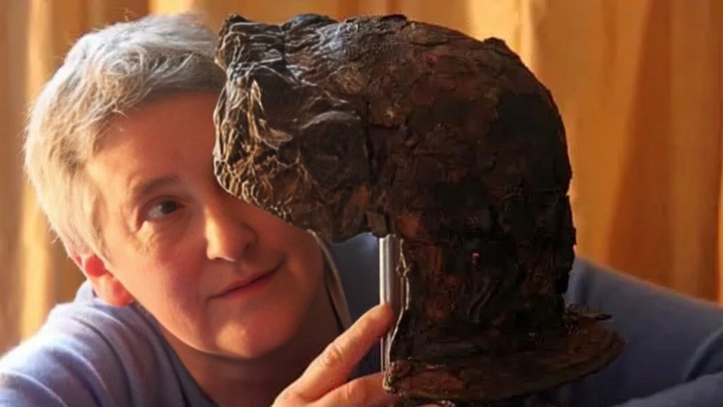 <p>British Museum conservator Marilyn Hockey, together with her colleagues Fleur Sheaman and Dygu Camurcoglu, undertook the painstaking process of cleaning, reassembling, and preserving the Hallaton Helmet.</p><p>The helmet was in rough shape. The metal had severely corroded, and the helmet had broken into thousands of pieces. Some of the pieces were tiny … smaller than an eraser at the end of a pencil. It took nine years to reassemble the Hallaton Helmet.</p>