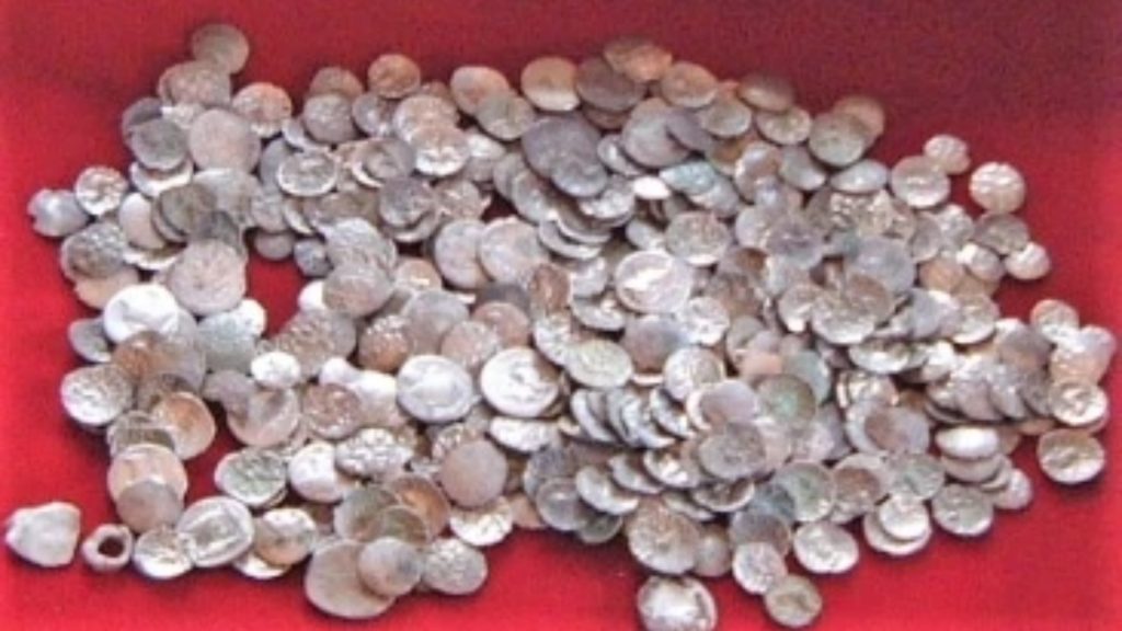 <p>After the discovery of the coins and the Hallaton Helmet, archaeologists from the University of Leicester Archaeological Services conducted a large-scale excavation of the site. They uncovered many more artifacts which are collectively known as the Hallaton Hoard.</p><p>Source: hallatonfwg.wordpress.com</p><p>In total, more than 5,000 Roman and Iron Age coins were discovered, making it the largest trove of Iron Age coins ever discovered in Britain. A silver bowl and silver ingots were also found. The archaeologists unearthed thousands of animal bones and even located the remains of a defensive ditch that had been dug around the site.</p>