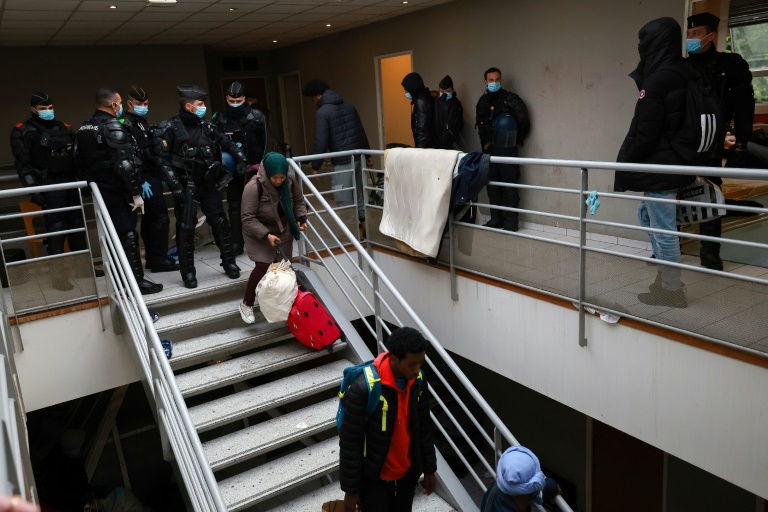 france evicts hundreds of migrants from paris squat ahead of olympics