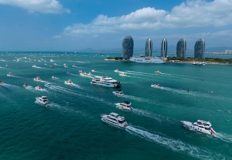 Tourists during the luxury yacht tour on the fourth day of Spring Festival holiday in Sanya, China.