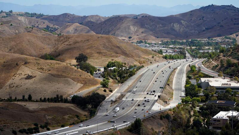 An overview of the Wallis Annenberg Wildlife Crossing, which will eventually be built over the 101 freeway, Tuesday, Sept. 20, 2022, in Agoura Hills, Calif. The construction for the 101 wildlife crossing started because a lone mountain lion known as P-22 would often roam Griffith Park, but was unable to cross the 101 to find a mate.