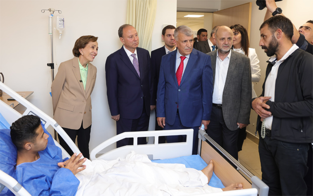 princess basma checks on patients receiving treatments