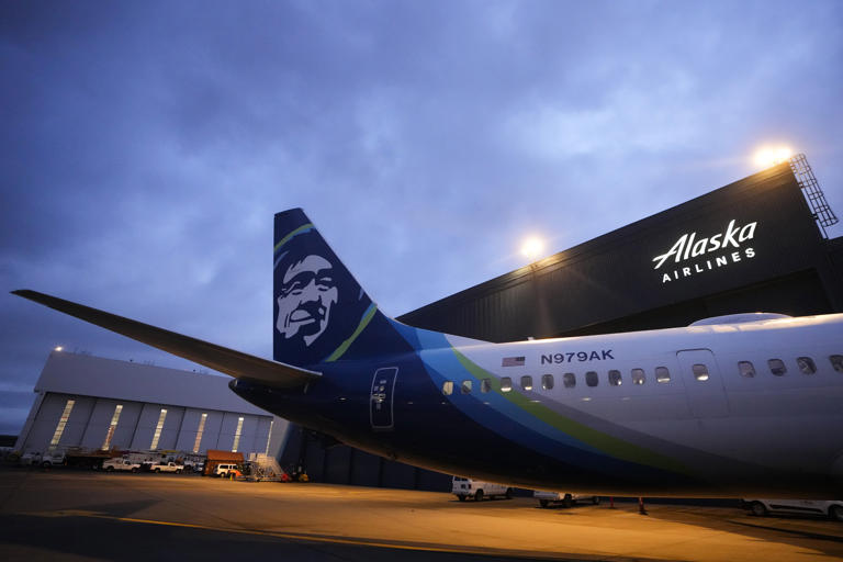 An Alaska Airlines Boeing 737 Max 9 with a door plug aircraft awaits inspection at the airline's hangar at Seattle-Tacoma International Airport Wednesday, Jan. 10, 2024, in SeaTac, Wash. On a Jan. 5 Alaska Airlines flight, a panel used to plug an area reserved for an exit door blew open midair, forcing it to return to Portland. (AP Photo/Lindsey Wasson) (Photo: via Associated Press)