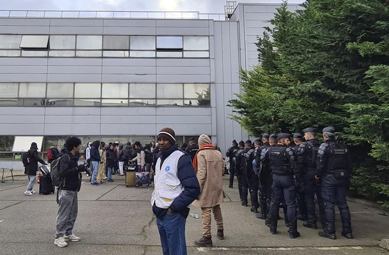 french police evict hundreds from abandoned paris warehouse ahead of olympics