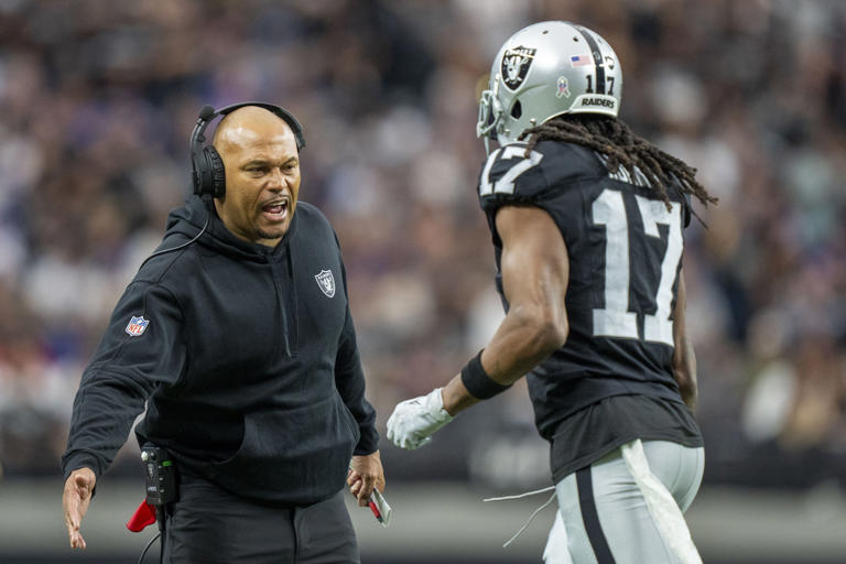 Las Vegas Raiders interim head coach Antonio Pierce (left) high-fives wide receiver Davante Adams (17) after a touchdown against the New York Giants during the first quarter at Allegiant Stadium. Mandatory Credit: Kyle Terada-USA TODAY Sports