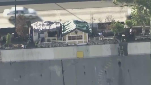Unhoused residents build home on side of Southern California freeway<br><br>