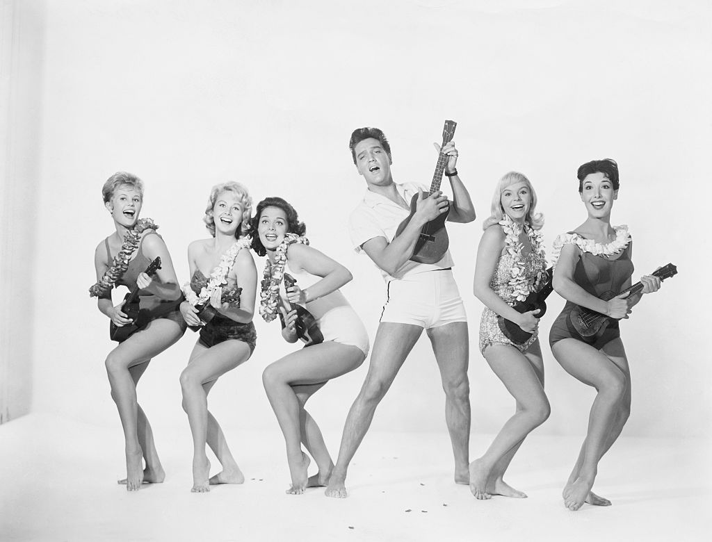 John Lennon famously remarked, "Before Elvis, there was nothing," a sentiment echoed by the catchy vigor of "Return to Sender." Featured in Elvis' 1962 film, <em>Girls! Girls! Girls!</em>, this track is a standout for its blend of pop and rock 'n' roll that manages to feel both playful and assertive. With lyrics about a man sending a letter to his love only to have it persistently returned, Elvis delivers each line with a mix of frustration and smooth charisma that became his signature style. The song not only climbed to number two on the Billboard Pop charts but also became a defining track of his career.