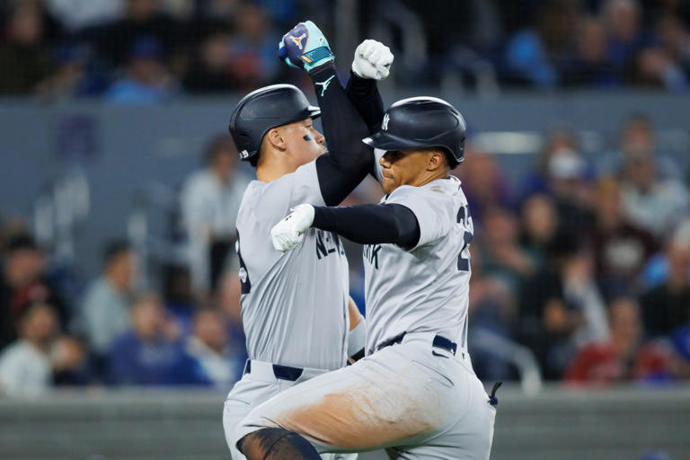 Juan Soto #22 of the New York Yankees celebrates with Aaron Judge #99 on a solo home run in the eighth inning against the Blue Jays on Wednesday. Getty Images