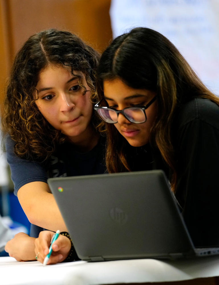 Briana Suazo and Darla Murillo work together in their advanced placement biology class, at the Jose Marti STEM Academy, Thursday, March 14, 2024, in Union City.