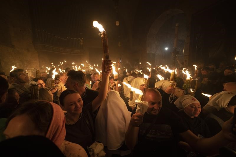 cheers and flames as orthodox worshipers greet the ancient ceremony of the 'holy fire'