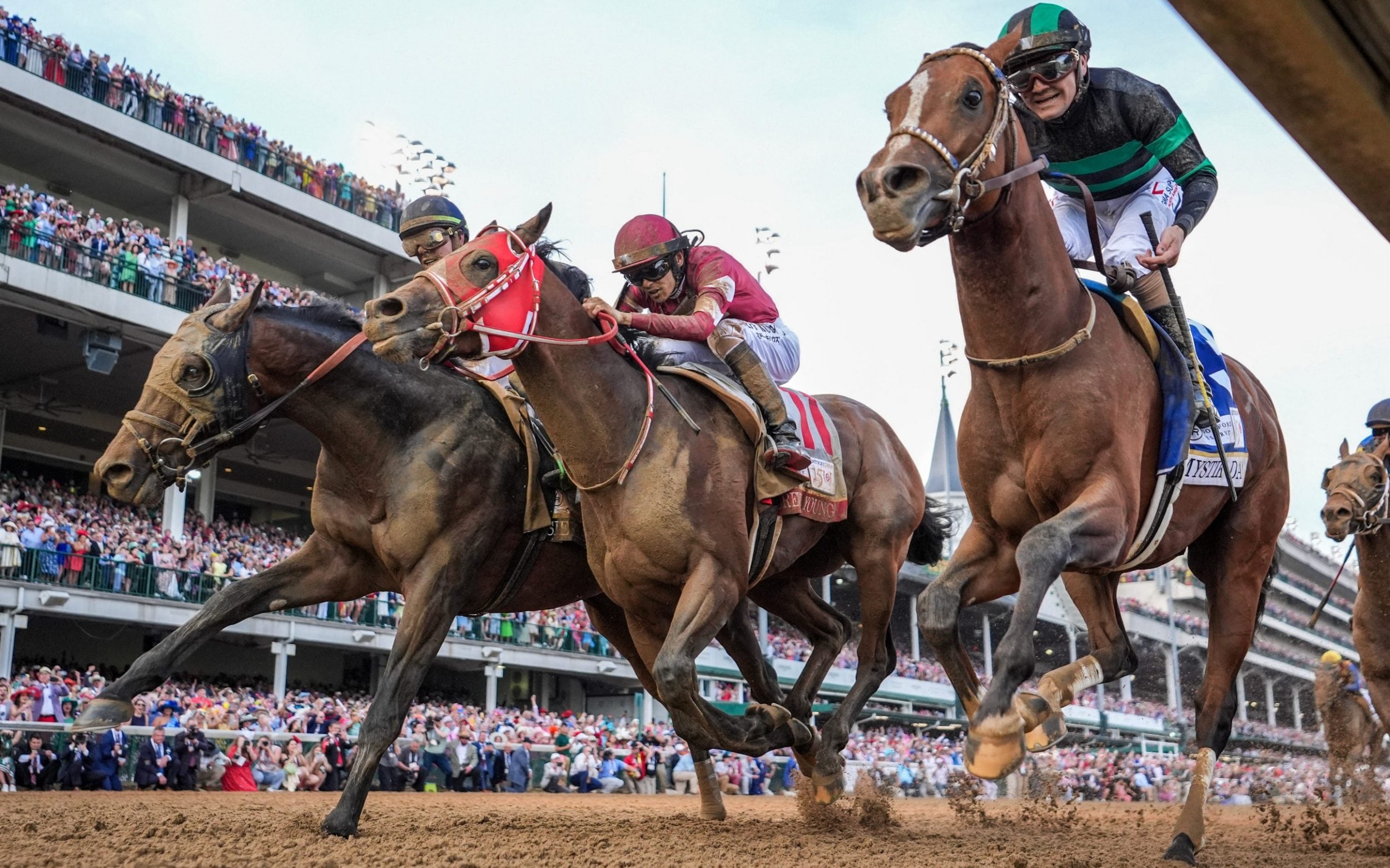 mystik dan, at 18-1, just edges out two rivals to win the 150th kentucky derby