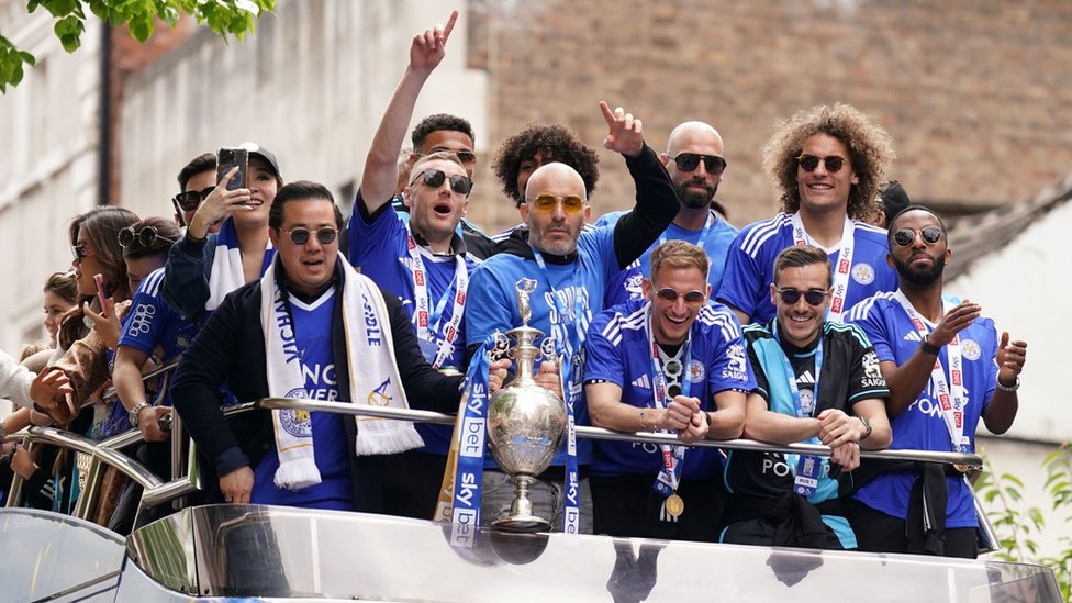 leicester city fans line streets for club champions