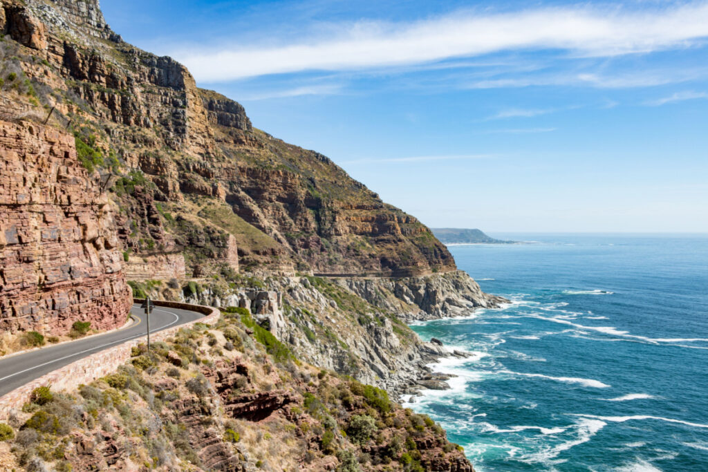 <p>Chapman’s Peak Drive is a 9-kilometer route that winds its way between Noordhoek and Hout Bay on the Atlantic Coast, on the southwestern tip of South Africa. With 114 curves, this road is a paradise for riders who love a twisty route. The panoramic sea views are simply breathtaking, and the route offers several spots to pull over and take in the stunning scenery. The road is a feat of engineering and was initially opened in 1922.</p>
