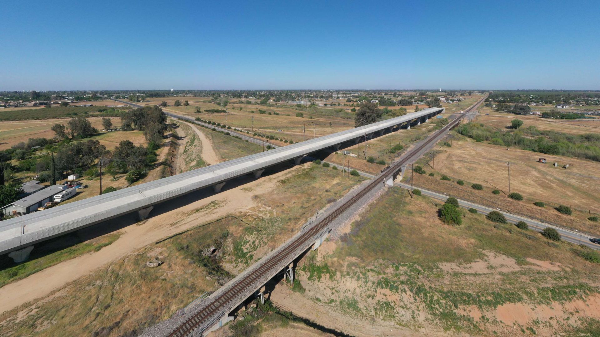 <p>The Fresno River Viaduct, one of the first completed structures of the high-speed rail system, spans nearly <a href="https://nypost.com/2024/05/04/us-news/california-mocked-over-high-speed-rail-bridge-to-nowhere-that-took-9-years-to-build/">1,600 feet</a>.  </p> <p>This structure is designed to let trains travel over the riverbed and run alongside the BNSF Railroad, yet it stands as a solitary achievement amidst broader project delays.   </p>