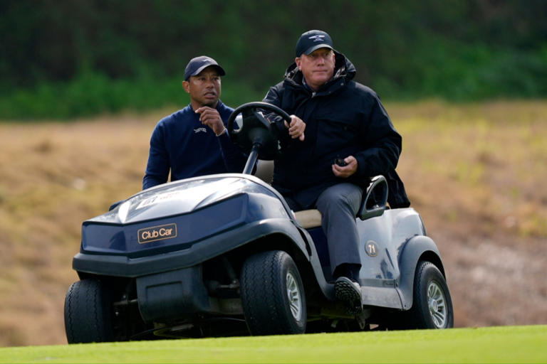 Tiger Woods is driven off the course after withdrawing during the second round of the Genesis Invitational.