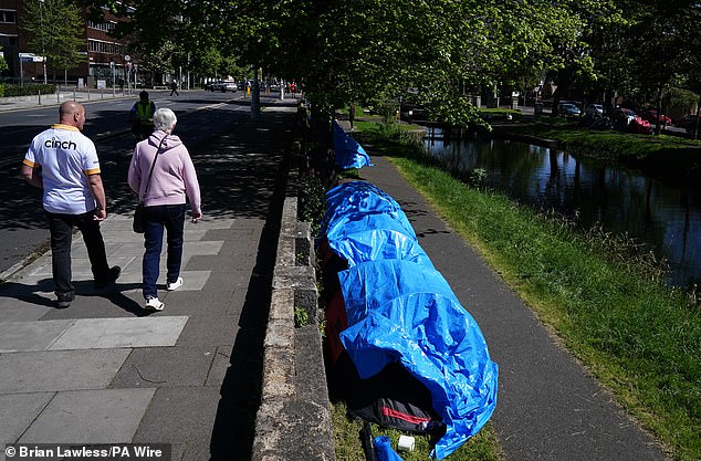 migrants pitch dozens of tents along the banks of dublin's grand canal
