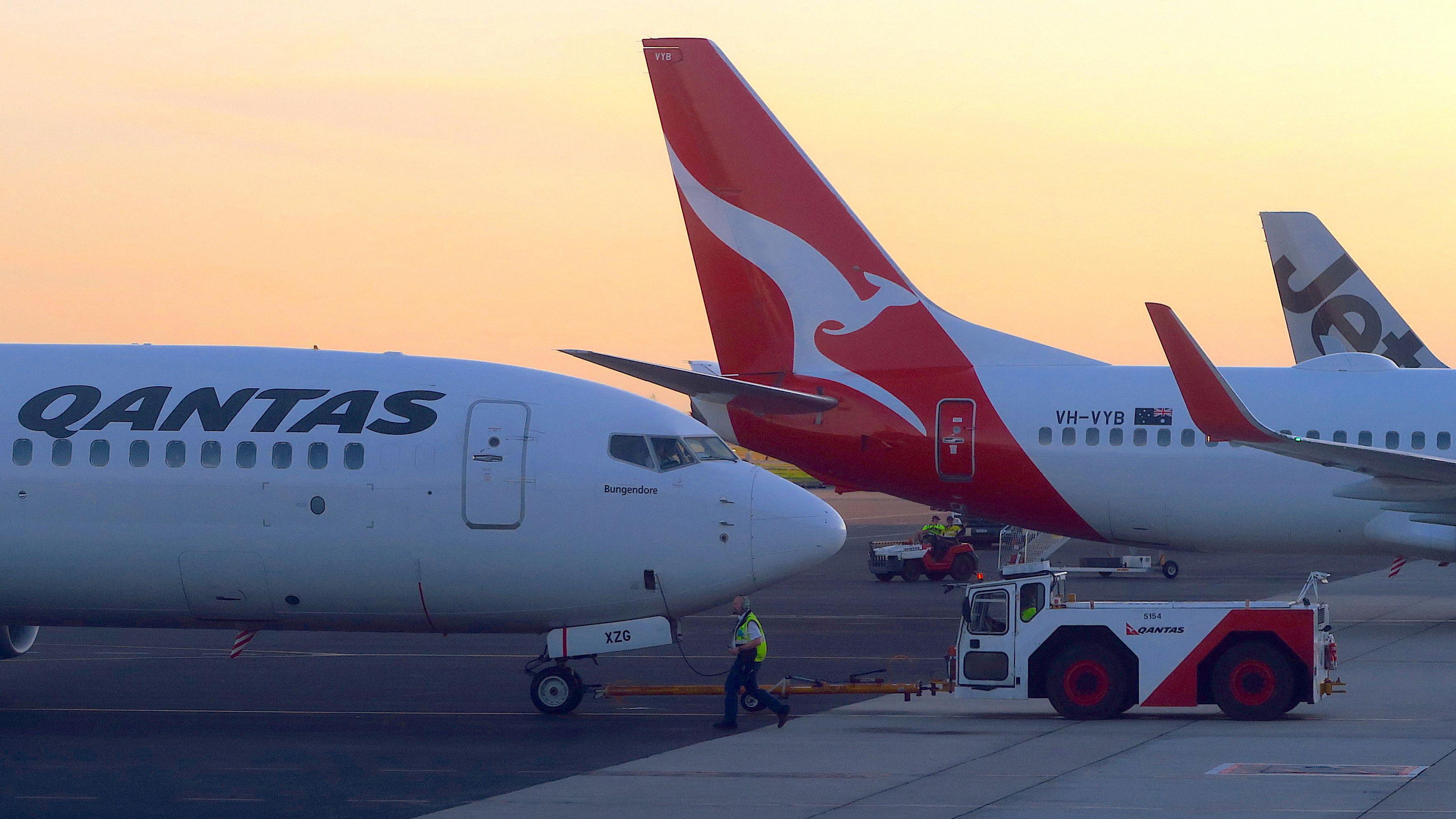 qantas agrees payouts over 'ghost flights'