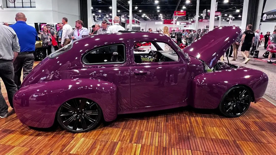 the iron maven is an all-electric volvo pv544 restomod with a villainous silhouette
