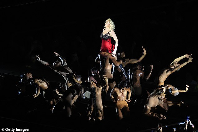 moment pickpocket is beaten and thrown into a bin at madonna concert