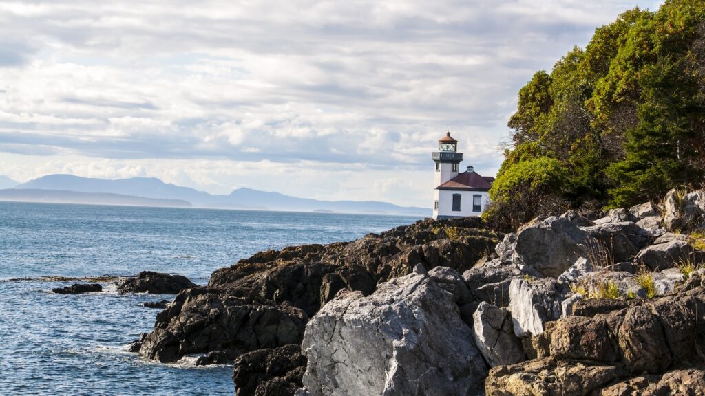 <p>Standing watch over the ominously named Dead Man’s Bay, the Lime Kiln Lighthouse is one of the newer active lighthouses in Washington. It was first lit in 1914 and is still an active navigational aid today.</p><p>The light helps ships navigating the swift currents that run through Haro Straits between San Juan Island and Victoria Island. During the summer months the lighthouse is open to visitors through tours with Lime Kiln Point State Park.</p><p><strong>More Articles from Roam the Norhtwest</strong></p><ul> <li><a href="https://roamthenorthwest.com/16-reasons-why-oregon-is-the-best-state-in-the-country/">16 Reasons Why Oregon is the Best State in the Country</a></li> <li><a href="https://roamthenorthwest.com/14-incredible-small-towns-perfect-for-a-weekend-getaway/">14 Incredible Small Towns Perfect for a Weekend Getaway</a></li> </ul>