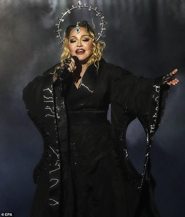 moment pickpocket is beaten and thrown into a bin at madonna concert