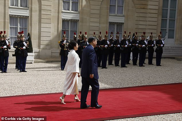 macron accused of 'flattering tyrants' as he poses with xi jinping