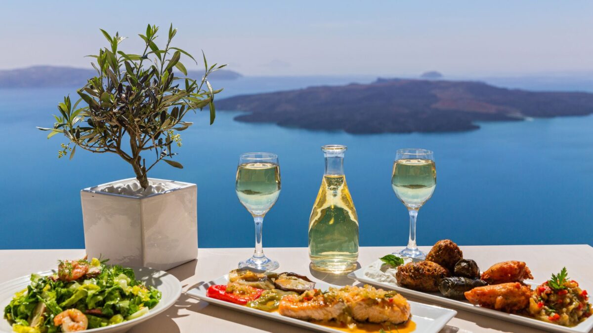 <p>A cruise through the Mediterranean treats you to stunning views, mesmerizing sunsets, and incredibly fresh food.</p><p><strong><a href="https://www.flannelsorflipflops.com/santorini-wineries/" rel="noreferrer noopener">Santorini is famous for its crisp white buildings, rich history, and tasty wines, </a></strong>but it’s also a living dream for food lovers. You can savor the catch of the day, locally grown veggies, olives, cheeses, and classic Mediterranean dishes like moussaka and Greek salad, all bursting with delicious flavors.</p><p>For endless restaurant and shopping options, head to Oia’s Main Street. It’s packed with eateries, shops, and fantastic views, making dining here unforgettable.</p><p><strong><a href="https://www.flannelsorflipflops.com/santorini-wineries/" rel="noreferrer noopener">Read more about Santorini Wineries and Wine Tours</a></strong></p>