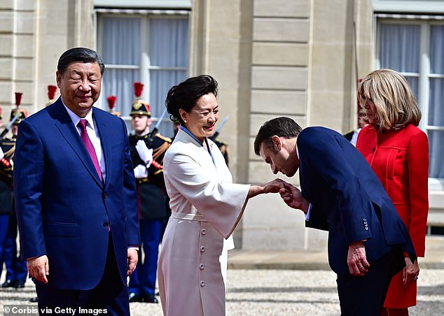 macron accused of 'flattering tyrants' as he poses with xi jinping