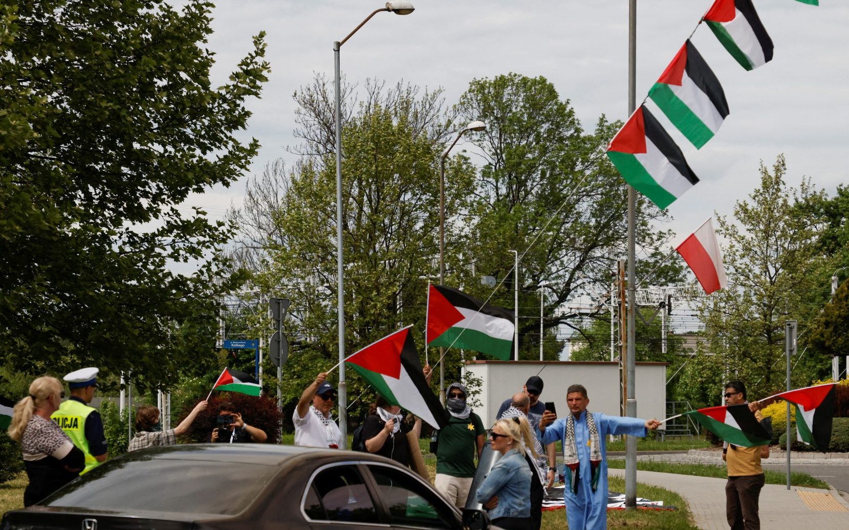 pro-palestinian protesters heckle holocaust memorial march at auschwitz
